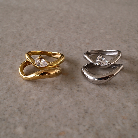 Gold vermeil and silver duet ring sets displayed side by side