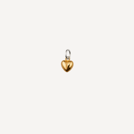 Gold heart-shaped pendant on a white background