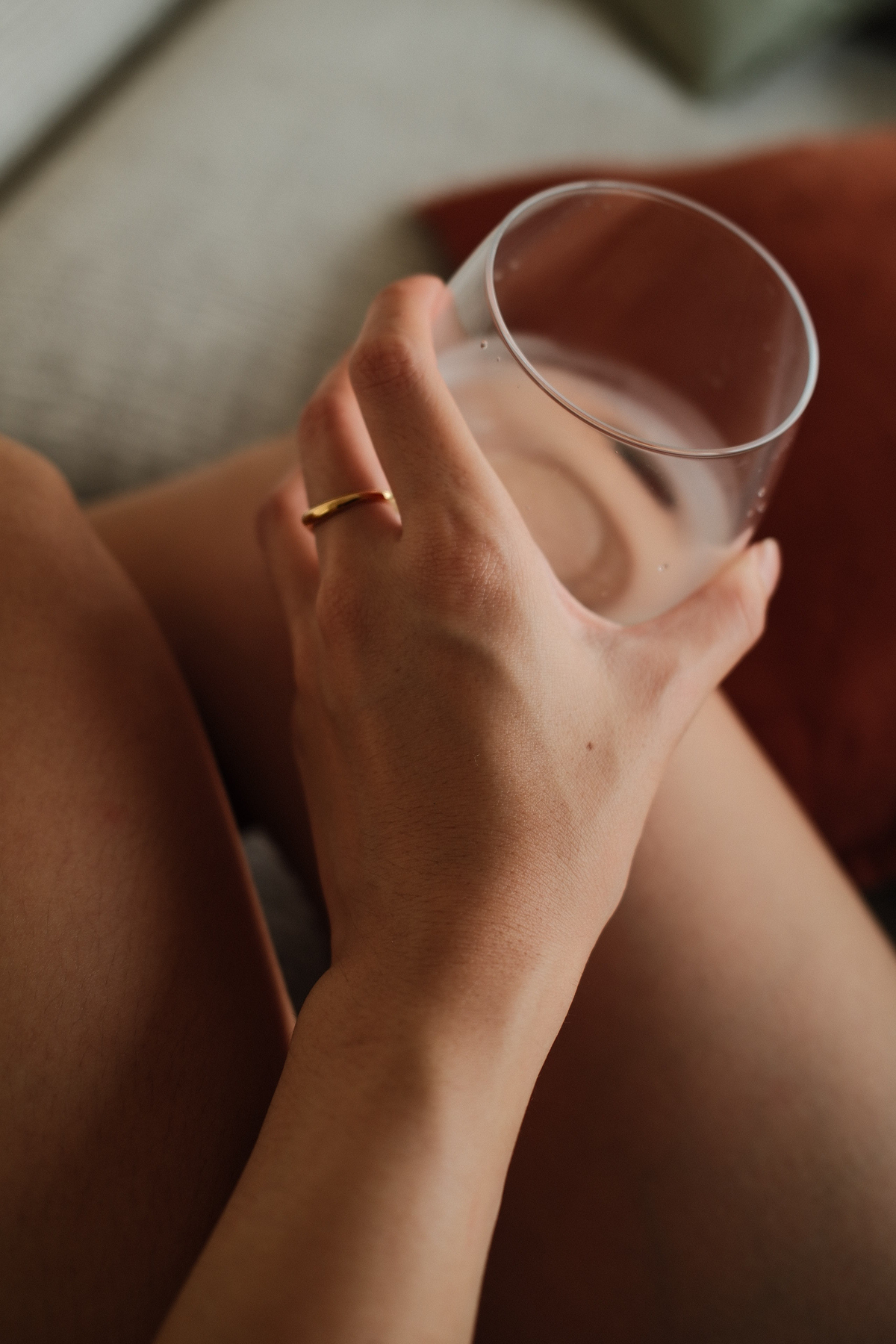 Close-up of gold vermeil duet Ring with pear-cut stone and curved band